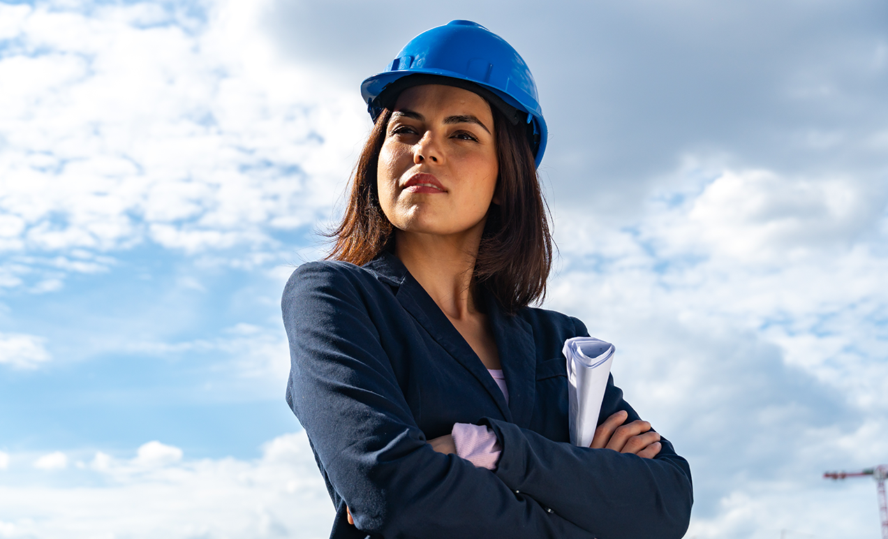 Licensed architect outdoors with project plans